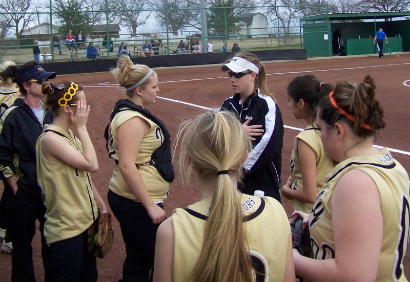 Image: Pregame Talk — Head Softball Coach Jennifer Reeves gets her young team focused on winning.