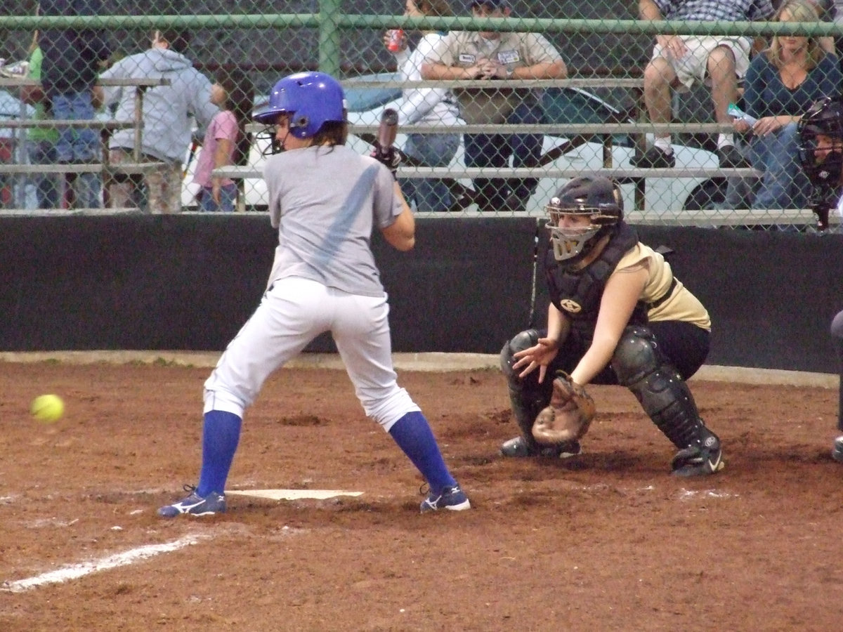 Image: Julia Reacts — Catcher Julia McDaniel takes care of her pitcher.