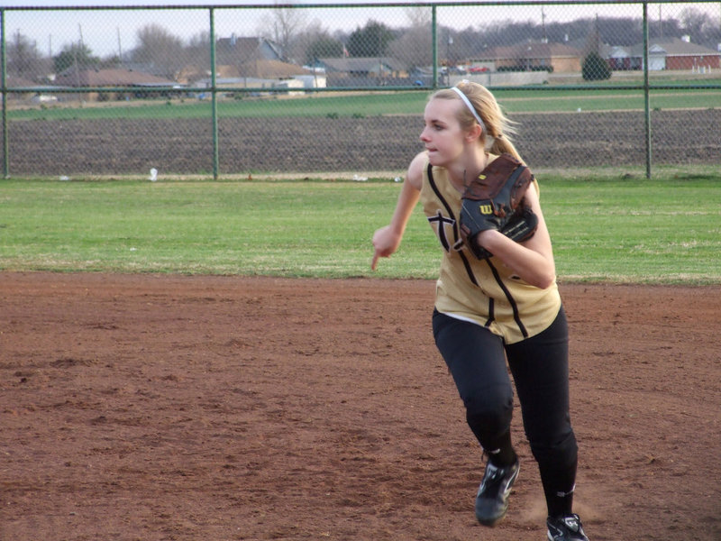 Image: Abby Griffith — Second Baseman, Abby Griifith, covers first base while first baseman, Drew Windam, moves in on the bunt.