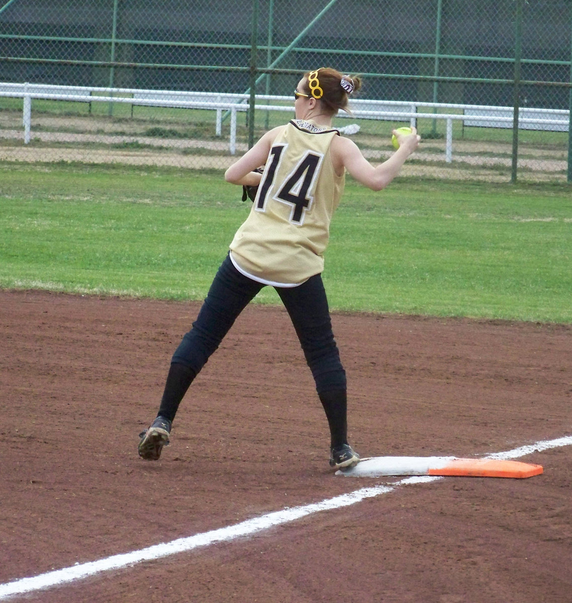 Image: There She Is — First baseman, Drew Windham, warms up the infield.