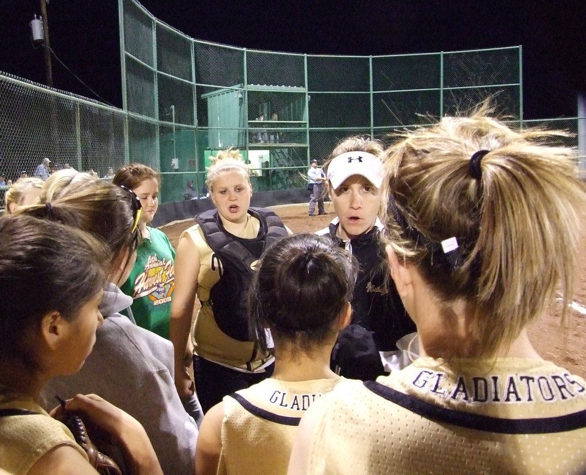 Image: Finishing Strong — Coach Reeves pumps up her players and the team responded by holding the Lions scoreless in the top of the 6th inning to earn the 13-9 win.