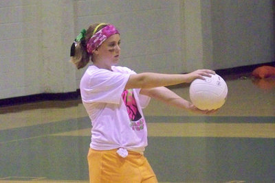 Image: Nelson — Kelsey Nelson (7th grader) prepares to serve.  Kelsey had a solid performance as both a server and a passer during the tournament.