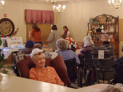 Image: Listening To The Music — Residents of Trinity Mission are enjoying the music.