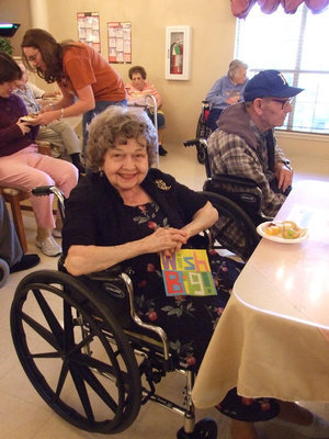 Image: Let’s Eat Fruit — Lillian, (resident) is ready to celebrate.