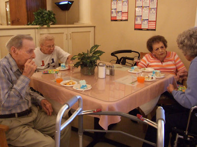 Image: Eating Birthday Cake — Trinity Mission residents enjoying the cake.