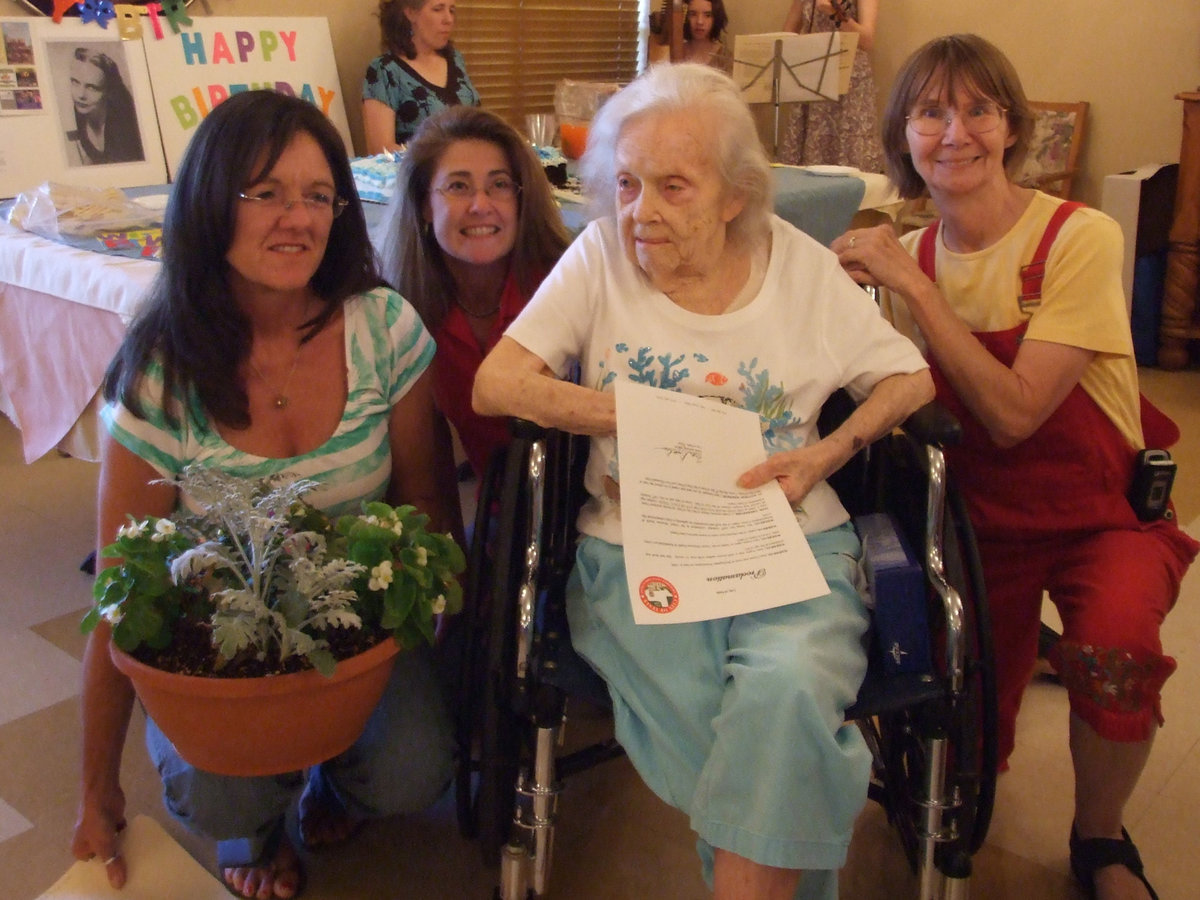 Image: You All Say Cheese — Terri Murdock, Rhonda Cockerham, June Frame and Pat Pratt smiling prettily for the camera.