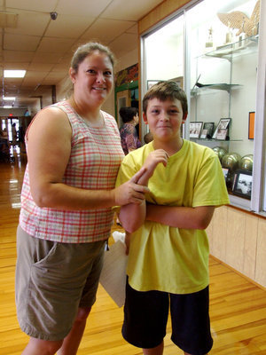Image: Shelly and Trace Boswell — Trace Boswell can’t wait for P.E. class.