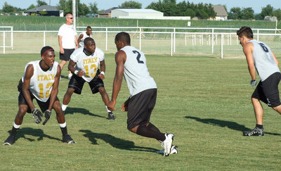 Image: Double D — John Issac and Desmond Anderson strong on defense against Palmer.