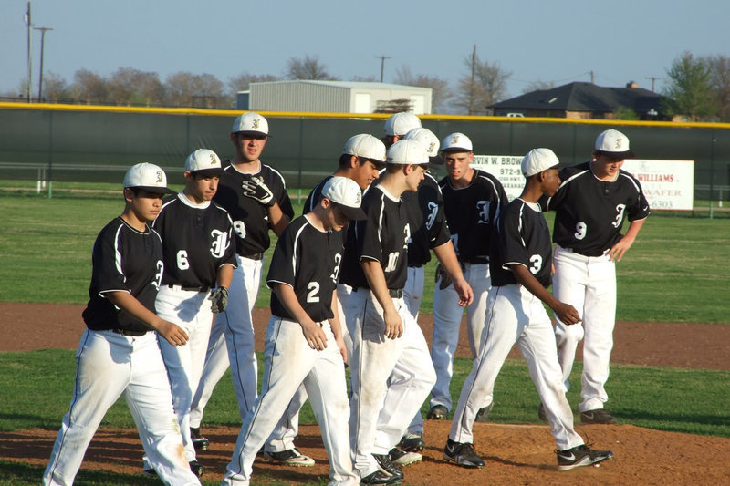 Image: Gladiator JV — Italy JV take a walk to the dugout on Friday night after the Grandview Zebras came to town.