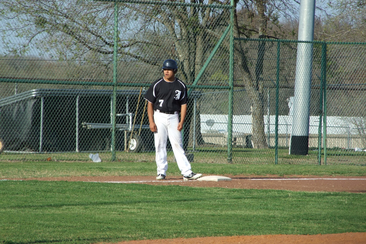 Image: Omar’s on 3rd — Omar Estrada watches the batter to make it safely to home.