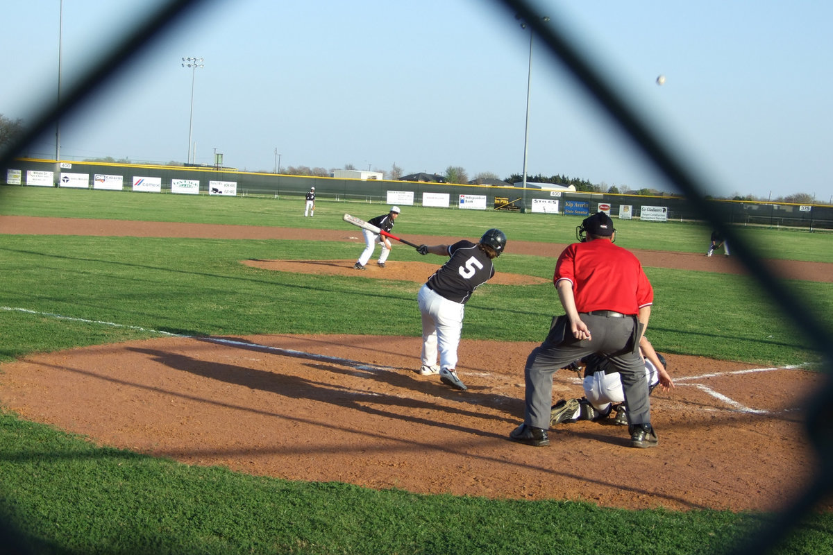 Image: Reid hits to centerfield — Reid Jacinto brings his bat to this game.