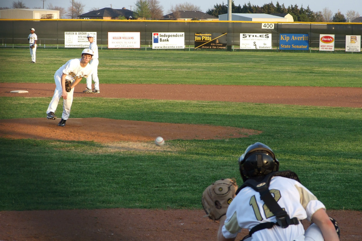 Image: Warming up — Caden Jacinto and Ryan Ashcraft warm up before the game.