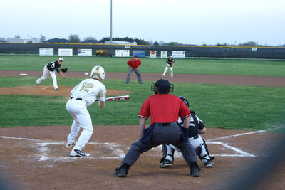 Image: Watch the bunt — Ryan Ashcraft gives the Zebras a bunt.
