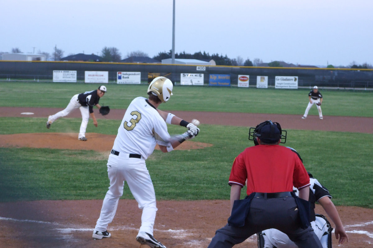 Image: Come on Jase — Jase Holden swings at the chest level ball, took a bold chance and stole to 3rd.