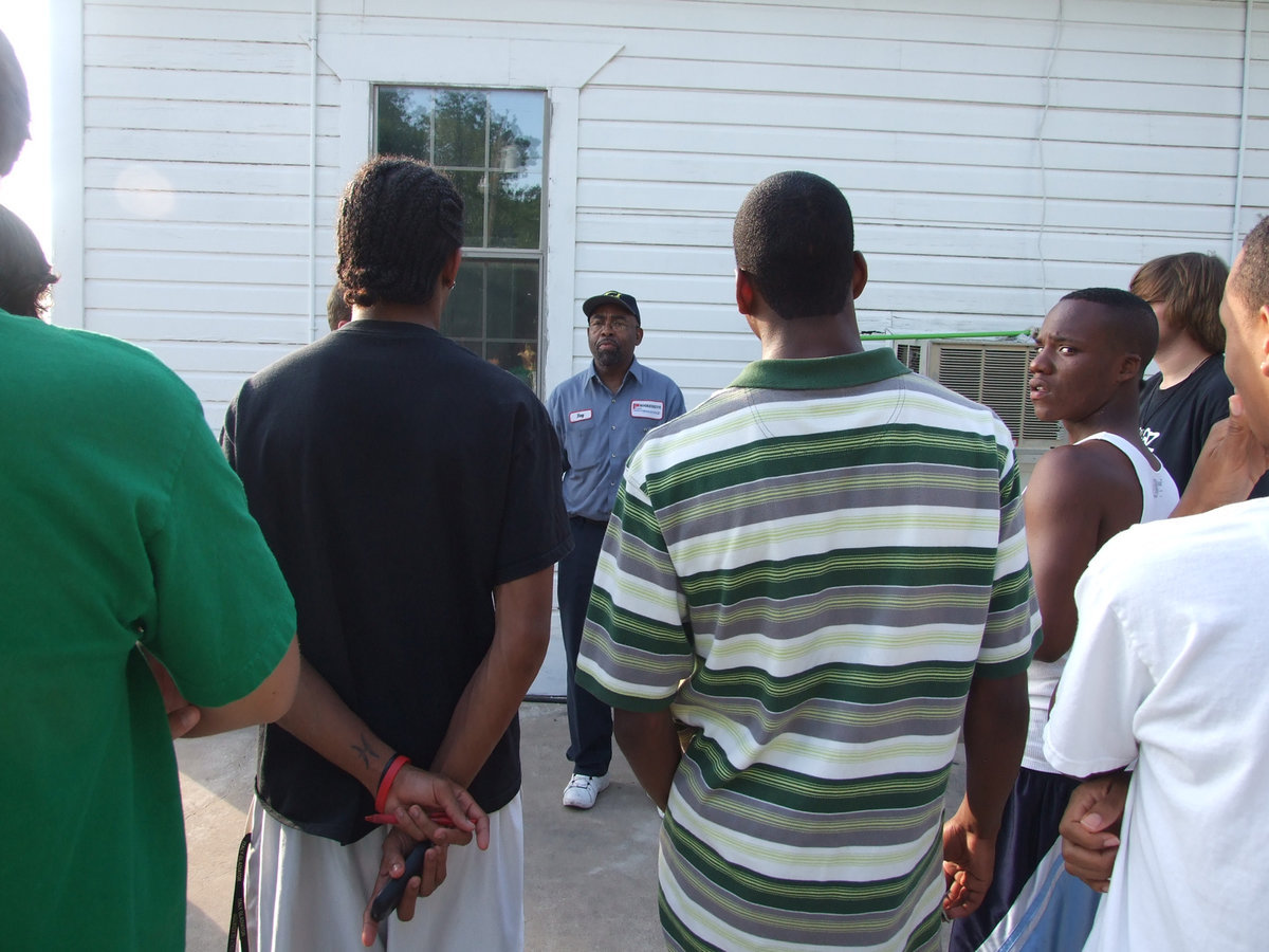 Image: Rev. Issac speaks — The graduates listened intently as Rev. Issac told them to “press forward” on Wednesday night at the Union Baptist cookout.