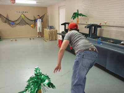 Image: Trent tries — The seniors had fun at the luau.