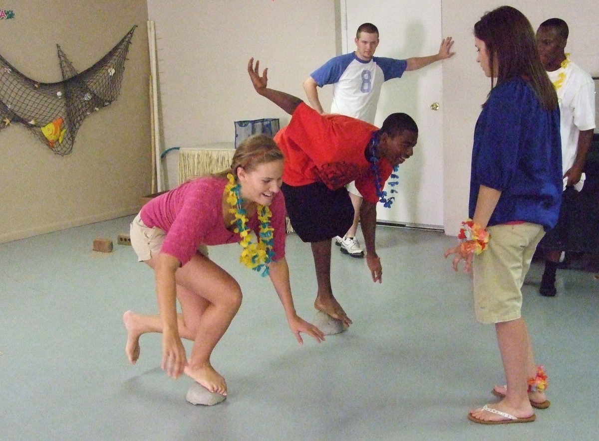 Image: Becca &amp; Butter — Becca DeMoss and Darrin Moore balance on the rocks.