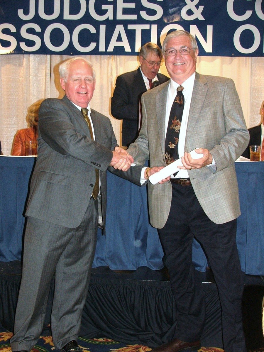 Image: CJCAT President Ray Meadows, McLennan County Commissioner, presents a Certificate of Achievement to Ellis County Commissioner Bill Dodson upon Dodson’s completion of a 64-hour advanced course on county government.