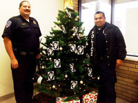 Image: Milford’s Angel Tree — Milford Police Chief Carlos Phoenix and officer Manny Valdez encourage you to come to Milford Police department and adopt an “Angel”.