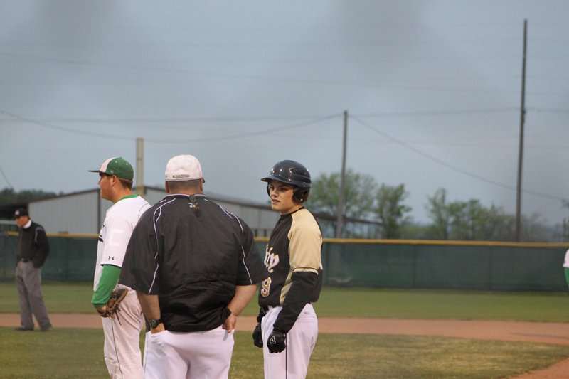 Image: Ethan and Coach Bales — Ethan Simon gets a little instruction from Coach Bales at 1st base.