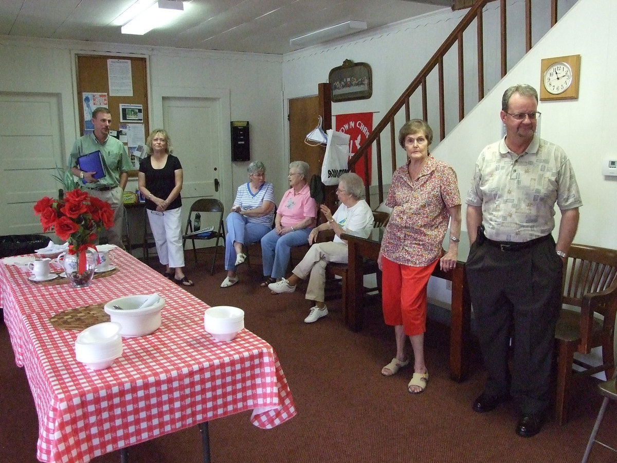 Image: The hosts  — First United Methodist ladies and Dr. Smith welcome everyone to the gathering.