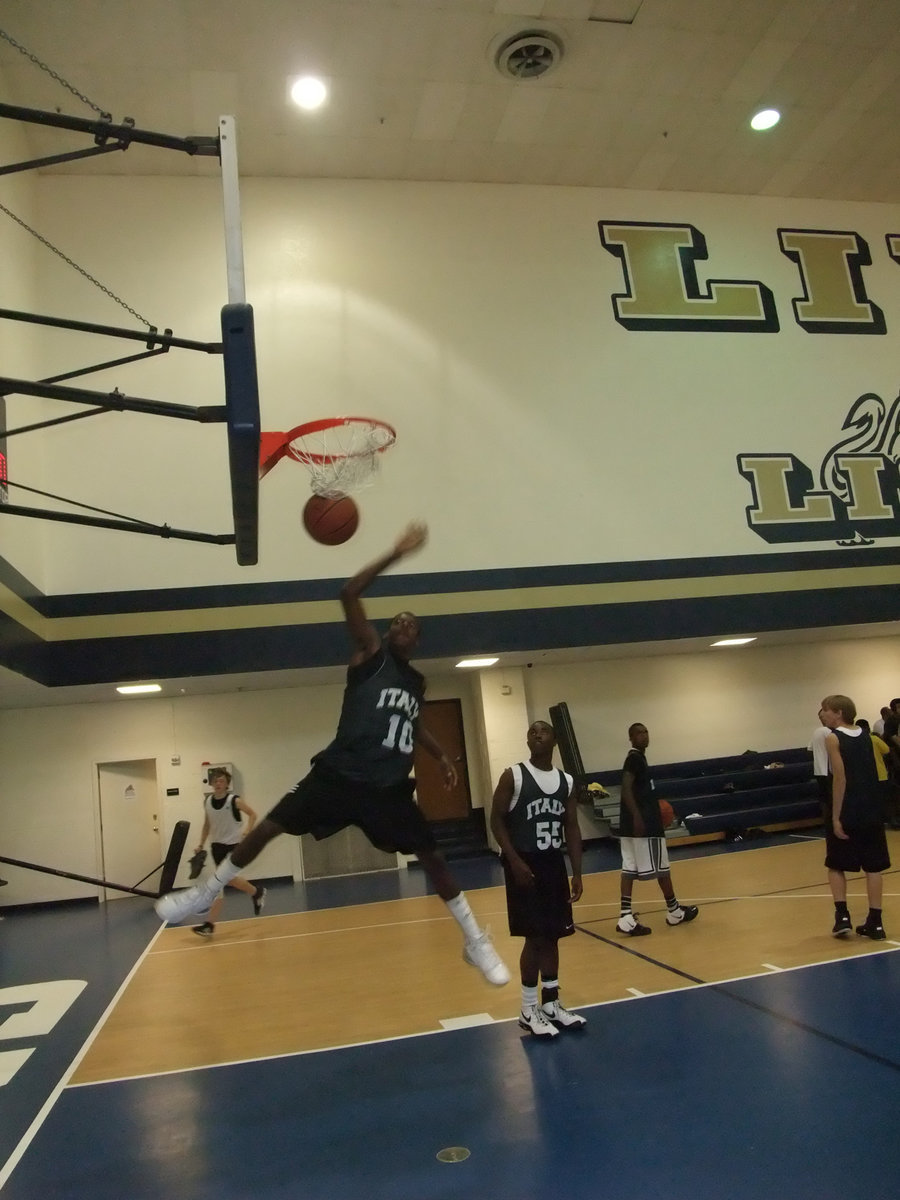 Image: The Dunk King — John Isaac slams in a message intended for the Ferris Jackets.