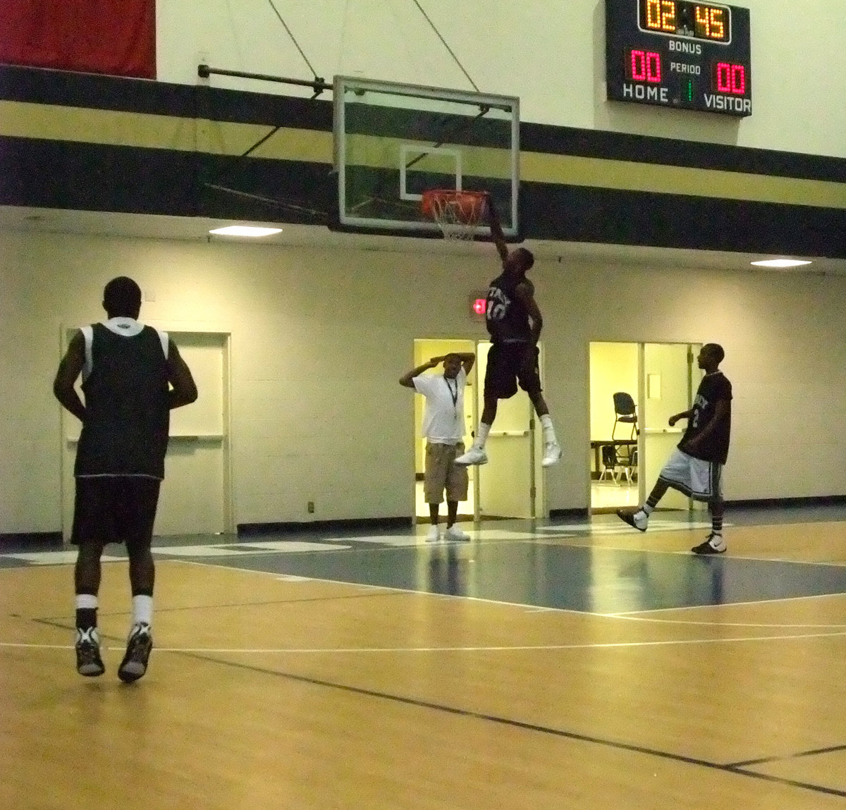 Image: One more time — John Isaac announces to the crowd that the Gladiators are in the gymnasium.