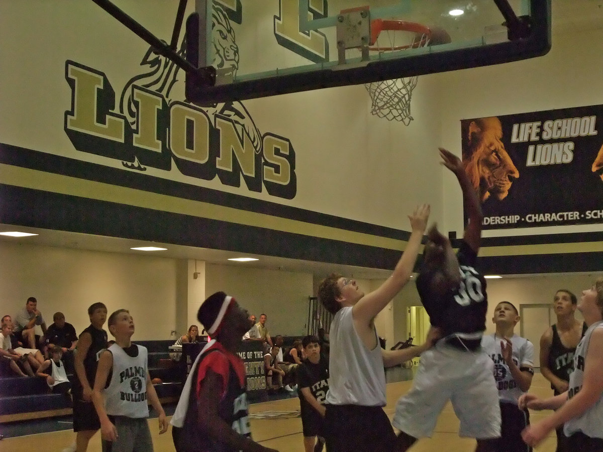 Image: Mayberry dominates — Larry Mayberry showed his potential against Palmer as he stayed aggressive and abused the Bulldog defenses during the Italy J.V. squads first game in the summer league.