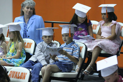 Image: We got skills — The graduates showed of their reading skills during the ceremony.