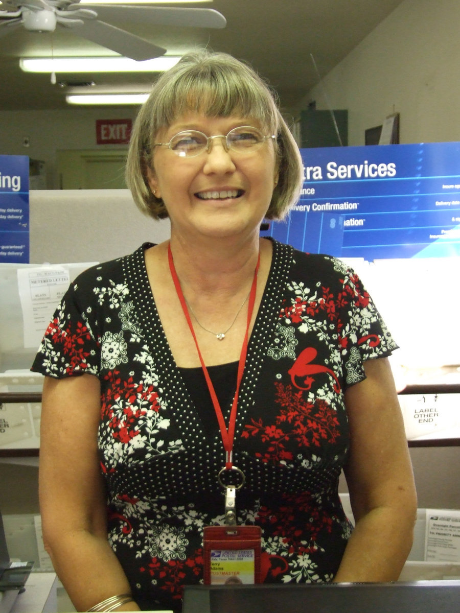 Image: Terry Adams — Terry Adams is the postmaster for the Italy Post Office and was delighted to have the students learn about the mail system.