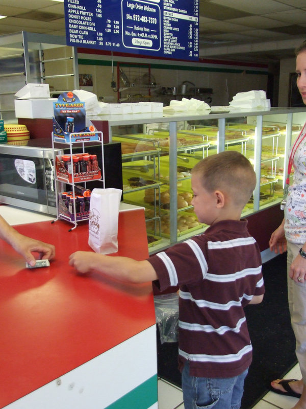 Image: How Much Are Donuts? — Here at the Italy Donut Shop the students are once again using their money skills by purchasing donuts.