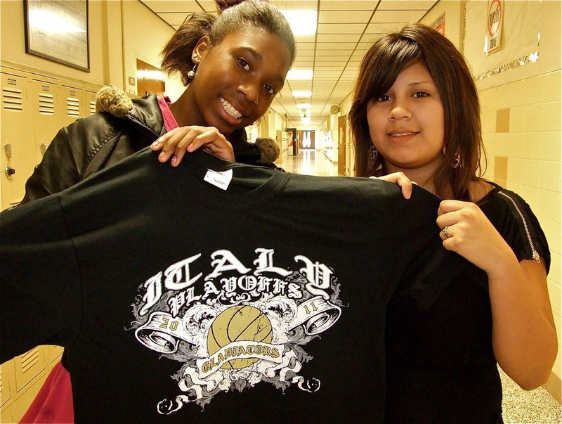 Image: Italy Gladiators playoff shirts are now available — Janae Robertson and Claribel Davila display the newly printed Italy Gladiators playoff shirt available for purchase for only $10.00 each.