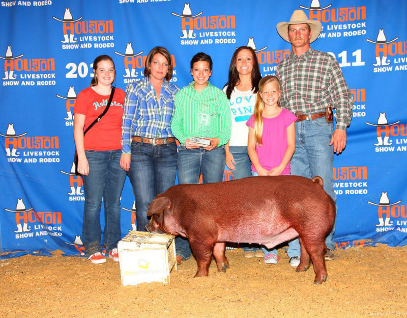 Image: Morgan Cockerham and, Kinsler, celebrate being 1st in Class — Enjoying the moment: Front row Your 2011 Houston Livestock Show and Rodeo, Duroc Champion of Class 68, Kinsler! Back row Reagan Cockerham, Dustie Jones, Morgan Cockerham, Hillary Gillen, Alex Jones and Wesley Jones.