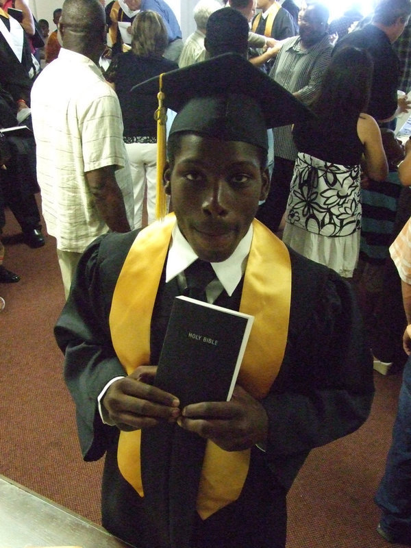 Image: Curtis Cole — Curtis, along with all the other seniors at IHS, received a bible from the Italy Ministerial Alliance.