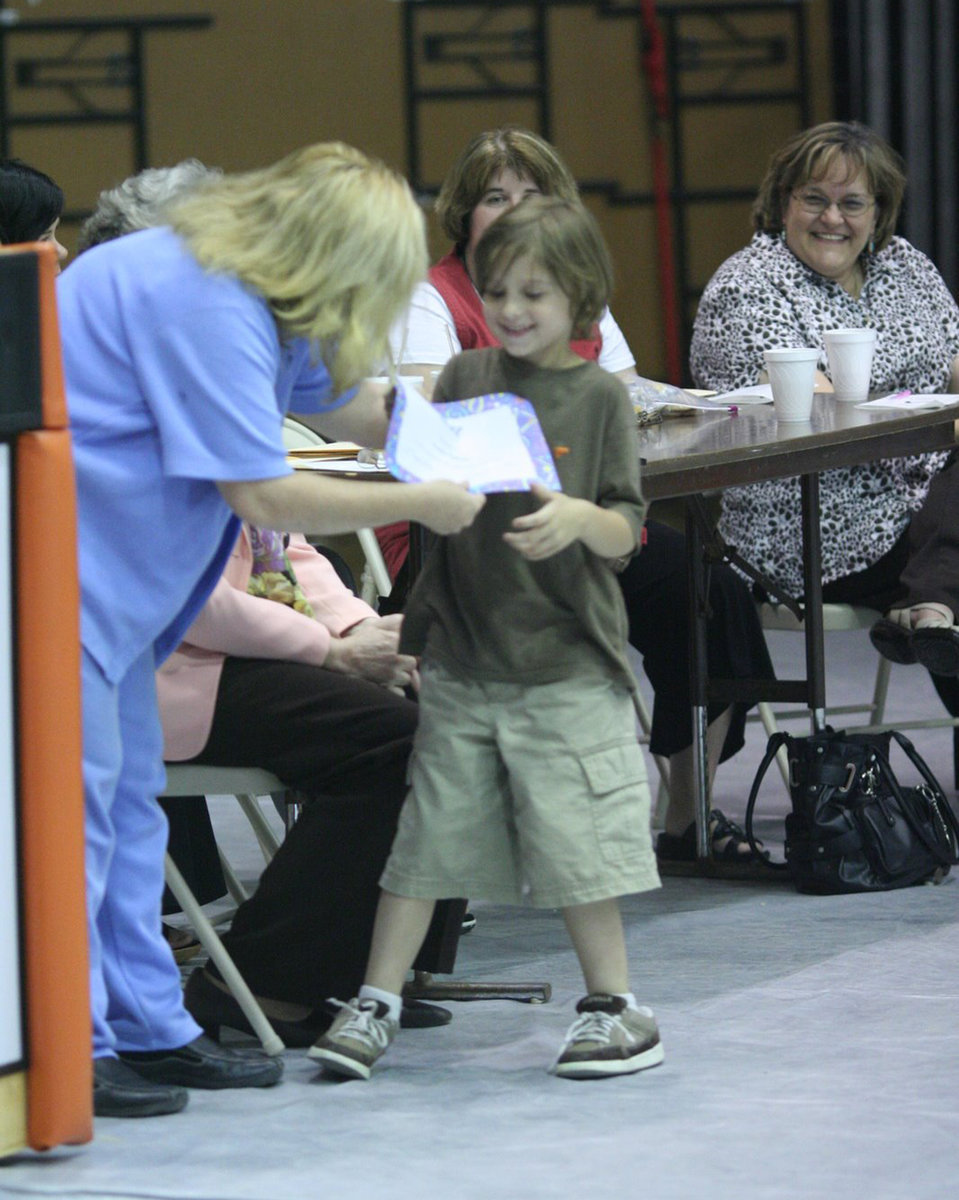 Image: Citizenship Award — Xander Galvan is all smiles while receiving his award.