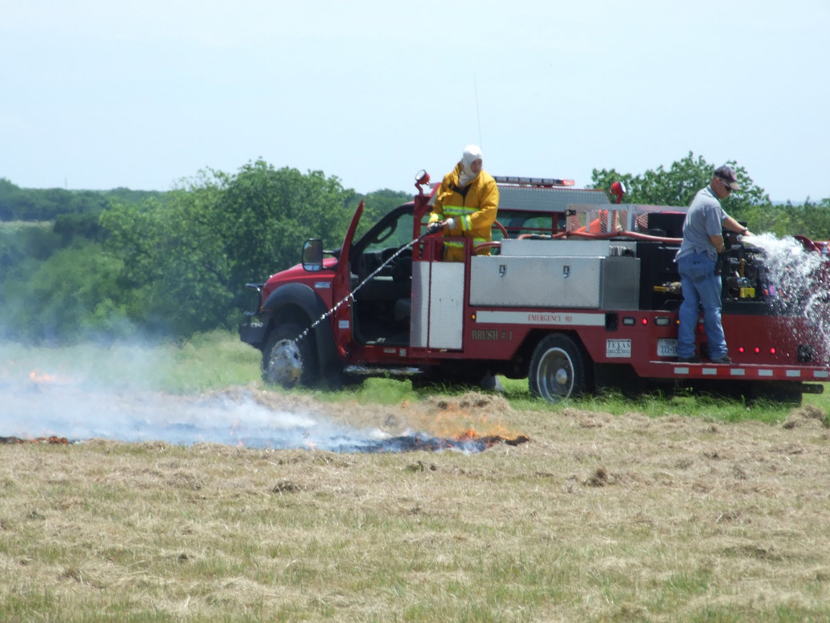 Image: Firemen on the scene — Firemen from Italy and Milford Fire Departments respond quickly and put out the fire.