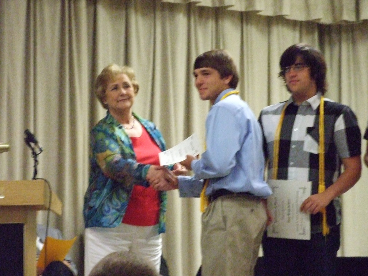 Image: Wanda Scott  — Mrs. Scott gives Clay Major, Trevor Davis, Tyler Boyd, Angelica Garza and Chase Michael the George E. Scott Memorial Scholarship.