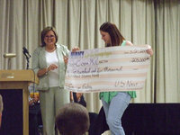 Image: Coda McCarthy — The Navy awarded Coda a check for her college life.