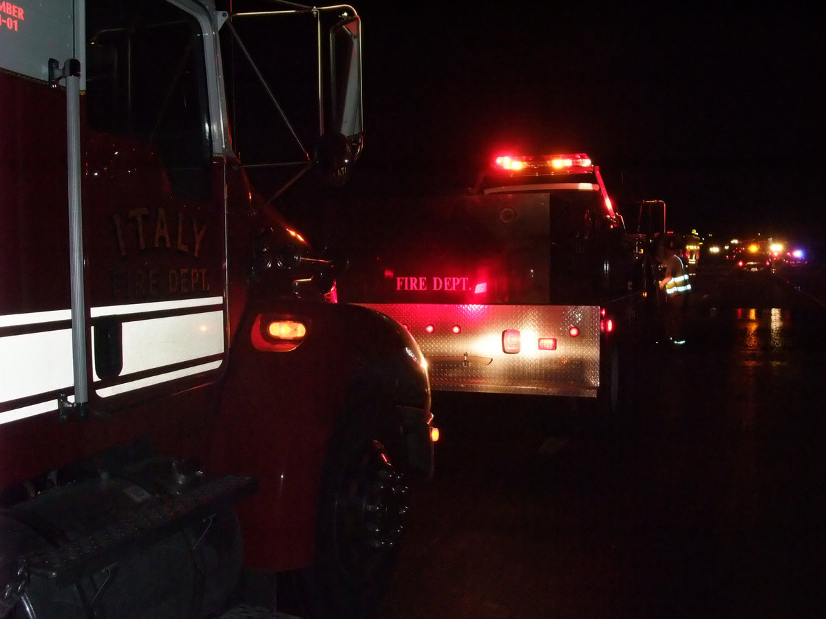 Image: I.F.D. responds — The Italy Fire Department relies on their fire engines for transportation, equipment, water and barricades to keep the rescue workers safe.