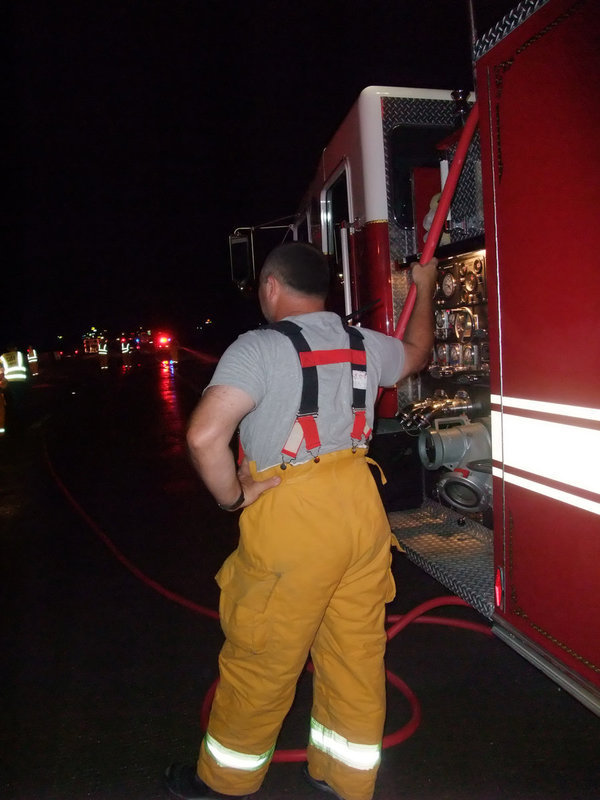 Image: At the controls — Italy Firefighters are well trained and know how to effectively use their emergency vehicles and equipment.