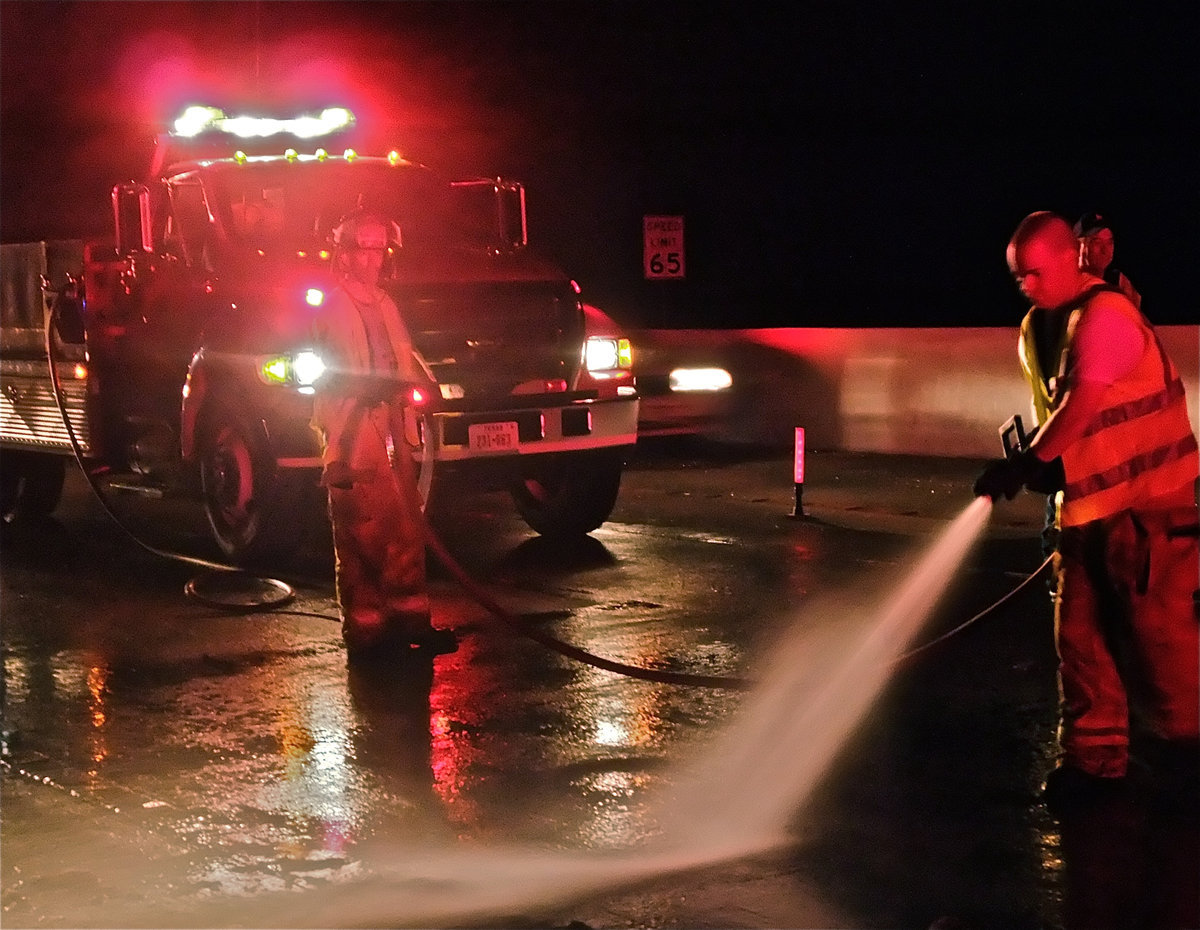 Image: Washing away — Clean up lasted over an hour on a warm night.