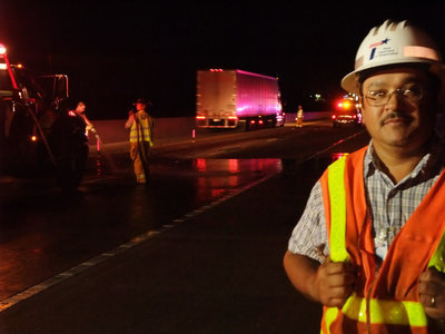 Image: TXDOT on the spot — Lorenzo Martinez of TXDOT pepares to clear away what’s left of the scene.