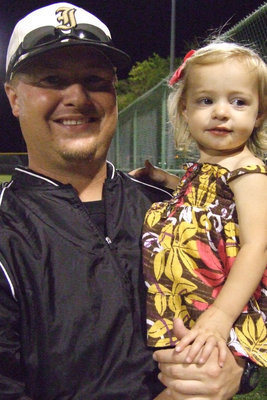 Image: Coach and Avery — Gladiator fan, Avery Gage, and Coach Ward check out the ballfield after the game Friday night.