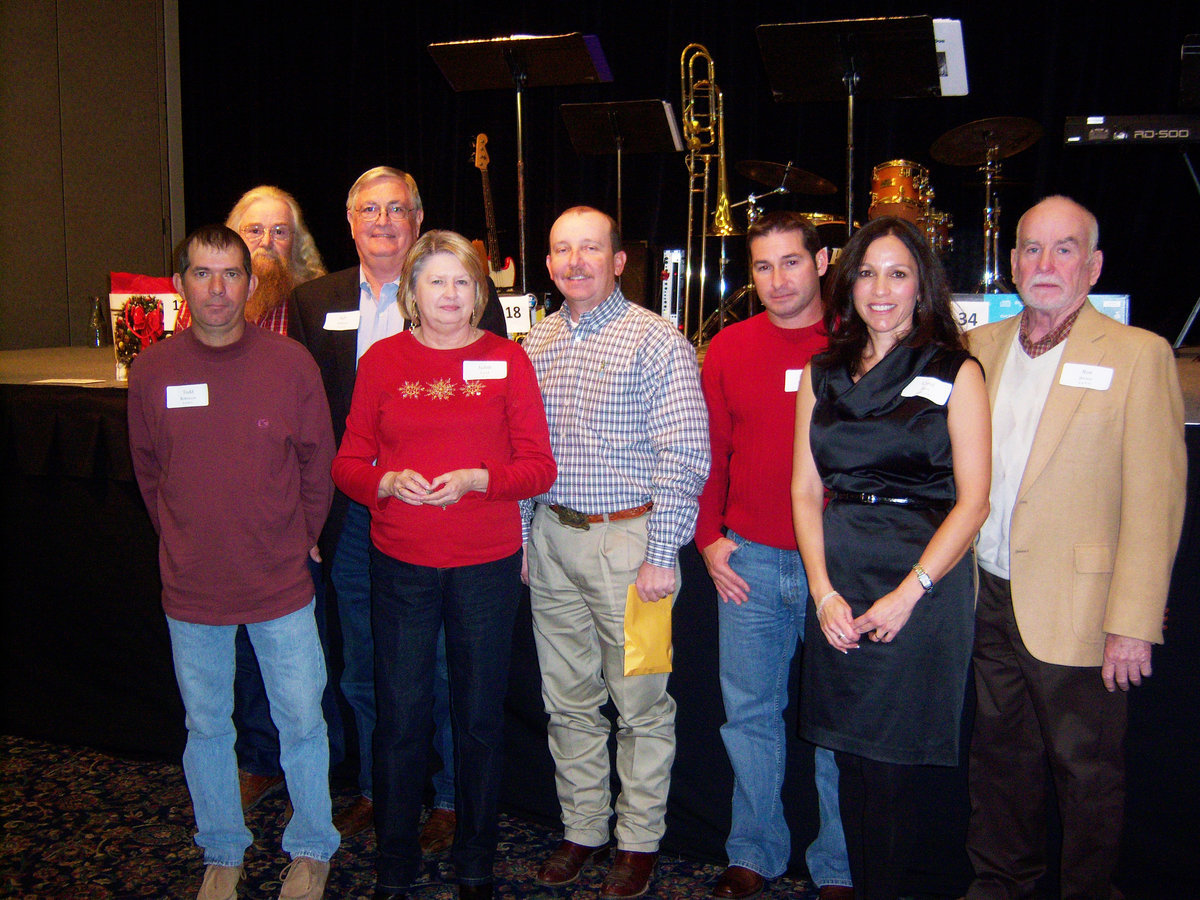 Image: 20 year employees — L-R: William Robinson, Johnny Hanes, Commissioner Bill Dodson, Judith Land, Commissioner Heath Sims, Commissioner Dennis Robinson, County Judge Carol Bush, Commissioner Ron Brown