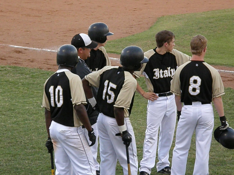 Image: What’s the plan — Coach Matt Coker helps his guys develop a strategy.