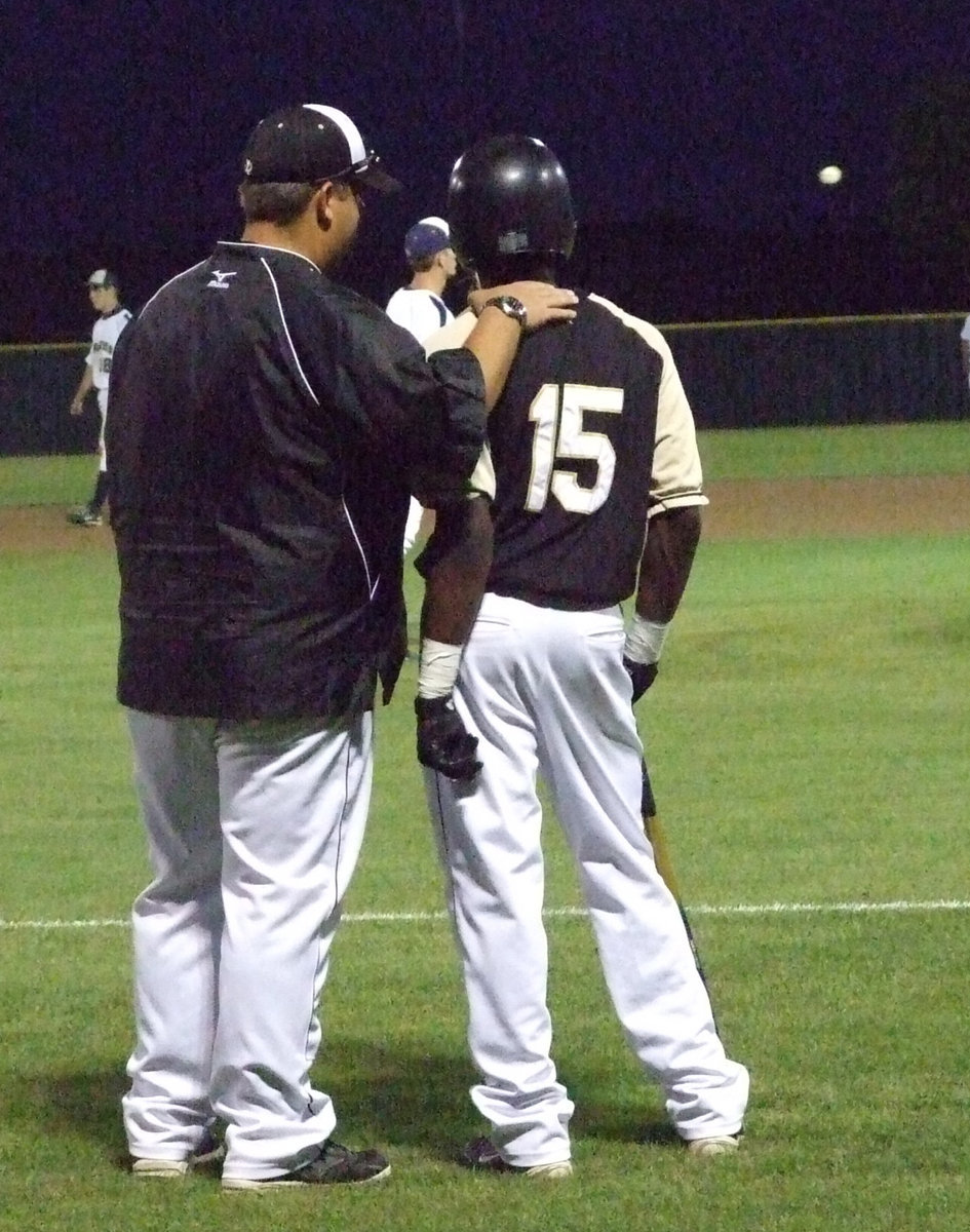 Image: Coach and Desmond — Coach Coker and Desmond Anderson talk about the plan.