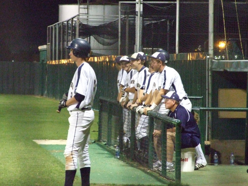 Image: Pirates wait it out — The team looks at the scoreboard waiting for a turn-around.