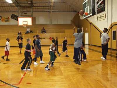 Image: Reaching their goal — Jarvis Harris puts up a shot in the 5th and 6th grade boys scrimmage on Monday.