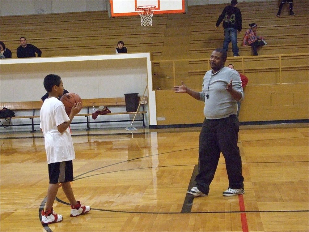 Image: Coach Glen McClendon — Coach McClendon breaks it down for the players.