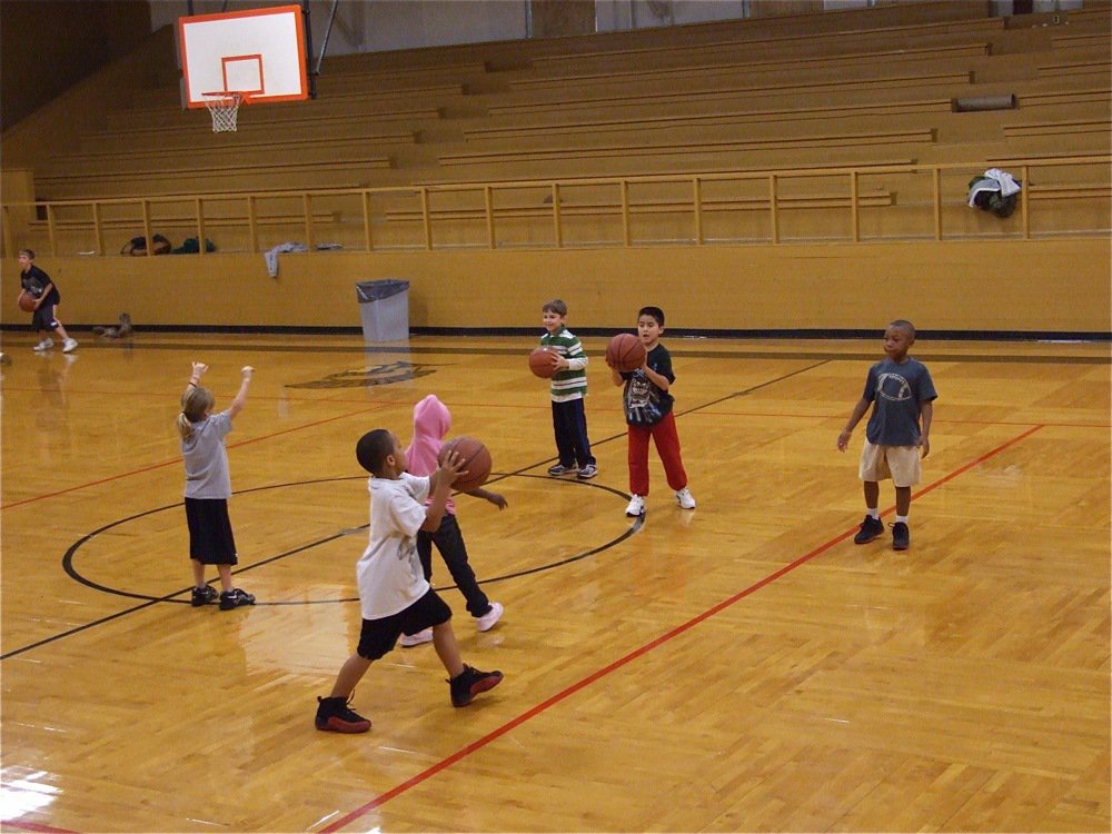 Image: Pass it to me! — The youngsters work on chest passes.